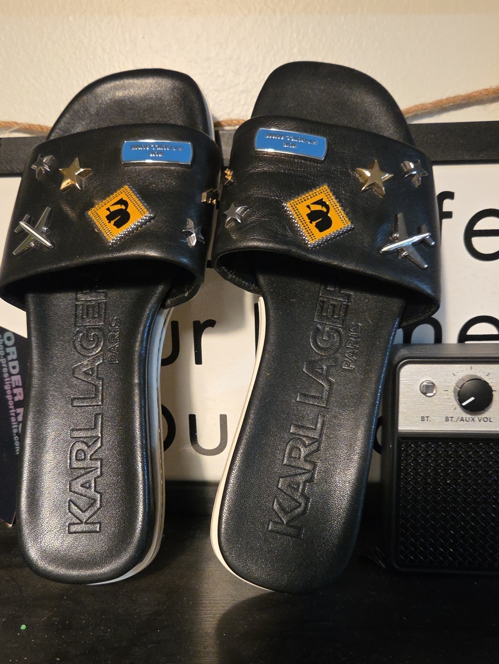 Karl Lagerfeld Black Slide Sandals with Metallic Star & Badge Accents